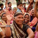 Women raising their hands
