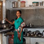A woman cooking at a stovetop