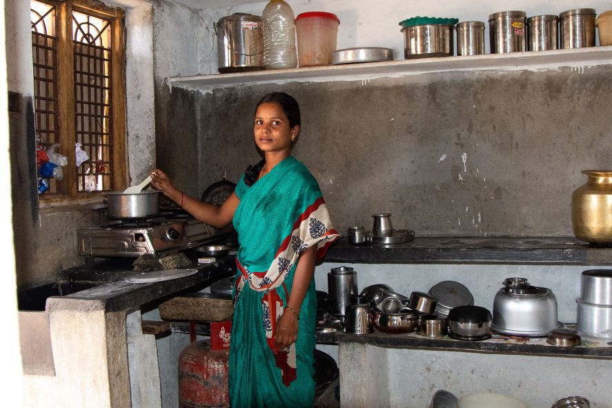 A woman cooking at a stovetop