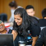 Students with computers working together