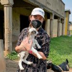 Kathryn Merckel holding a baby goat