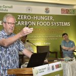 Harold van Es speaking at a podium