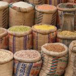 Colorful arrangement of pulses and lentils for sale at a market
