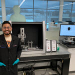 Rohil Bhatnagar standing in a lab