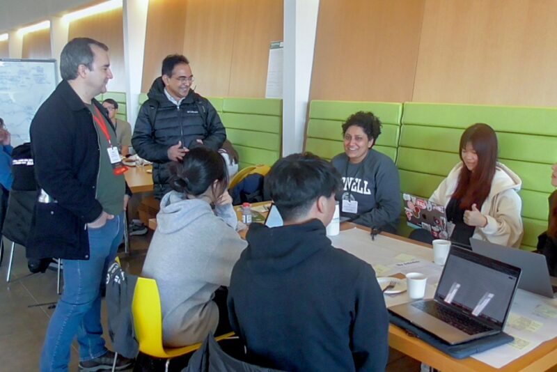 Students and mentors interacting at the Digital Ag Hackathon