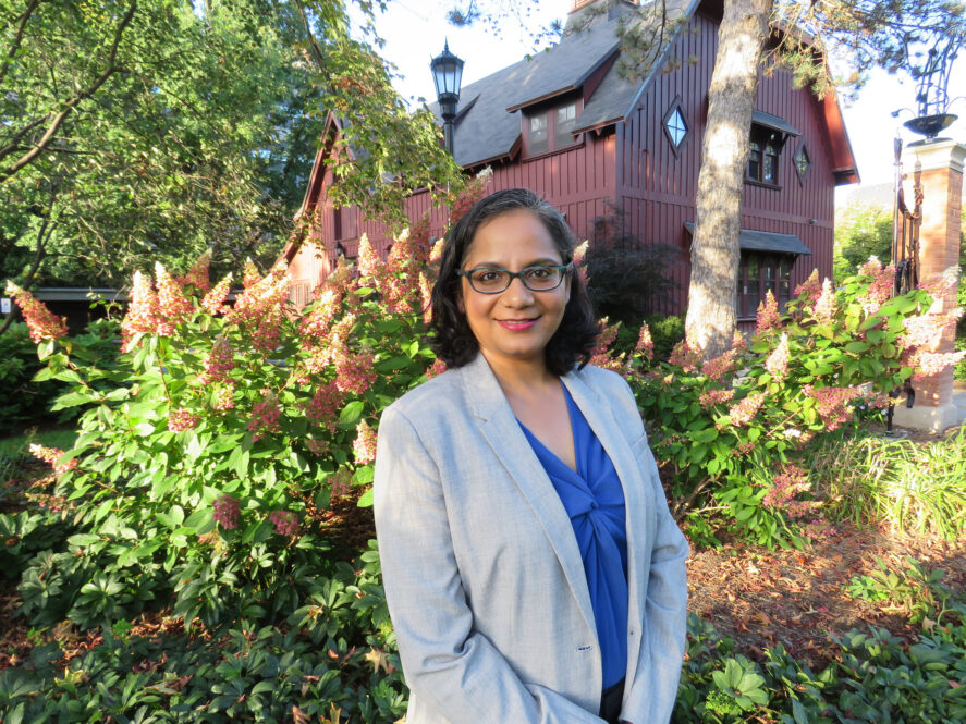 Anaka Aiyar in front of the Big Red Barn at Cornell University