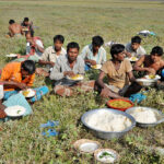 Agricultural workers break for a meal