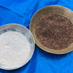 Bowls of millets and millet flour on a blue tarp