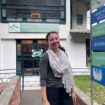 Grace Dunham standing outside of the House of Umang shop