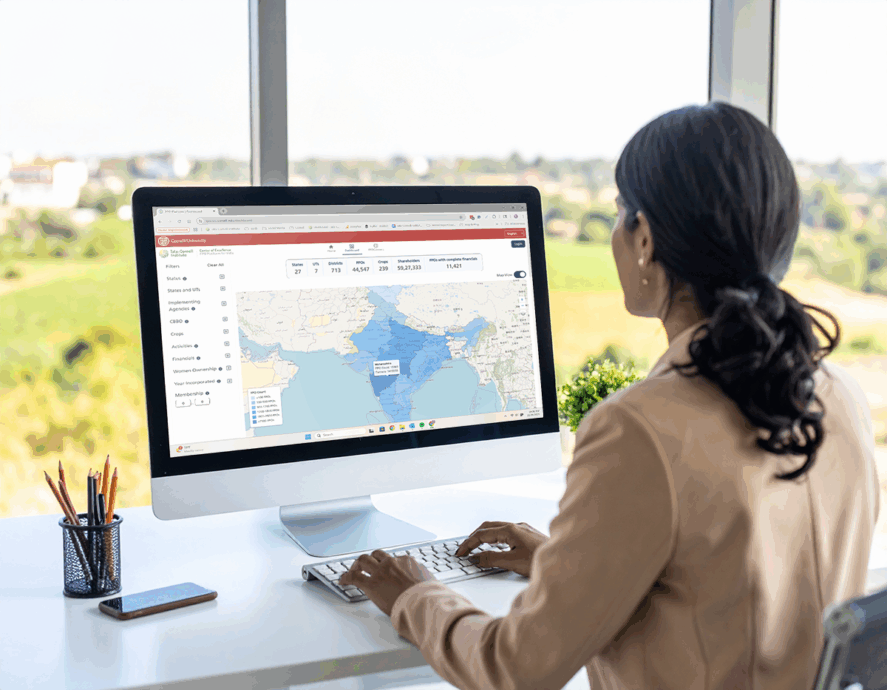 A business woman looking at a map of FPOs in India on her computer