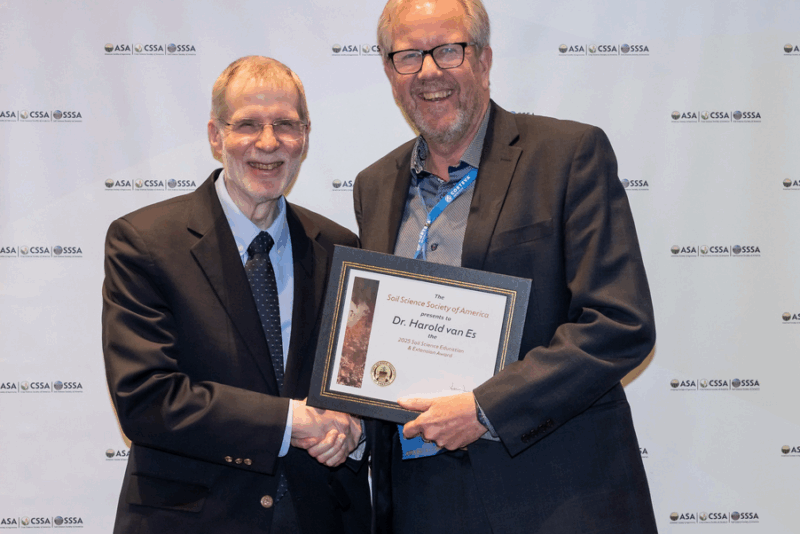 Harold van Es receiving an award